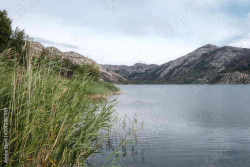 Sibinskiye Lakes landscape in East Kazakhstan. Scenic mountain lake natural background for travel agency marketing, tourism industry banners, wilderness exploration articles and nature websites