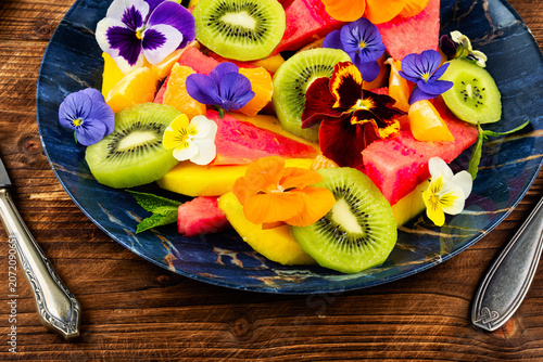 Fresh Summer Fruit Salad with Edible Flowers and Tropical F