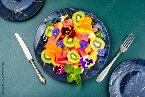 Rainbow Fruit Salad with Tropical Fruits and Edible Pansies