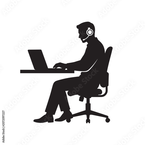 Silhouette of a Man on a Laptop with Headset