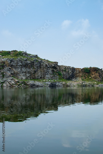 Tarpania Lake, Marble Lake, Blue Dam, Patal Dam or Durga Bera,a scenic lake in the Ajodhya Hills of Purulia, West Bengal, India. Deep blue water surrounded by sharp, white, marble-like rocky cliffs.