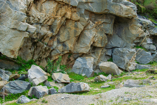 Rocks and stones of Tarpania Lake, Marble Lake, Blue Dam, Patal Dam or Durga Bera,a scenic lake in the Ajodhya Hills of Purulia, West Bengal, India. Blue water surrounded by marble-like rocky cliffs.