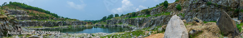 Panorama of Tarpania Lake, Marble Lake, Blue Dam, Patal Dam or Durga Bera,a scenic lake in the Ajodhya Hills of Purulia, West Bengal, India. Deep blue water surrounded by marble-like rocky cliffs.
