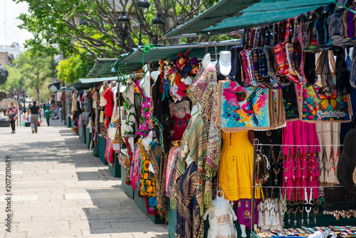 Colorful artisan market stalls with traditional crafts and clothing in Guadalajara Mexico