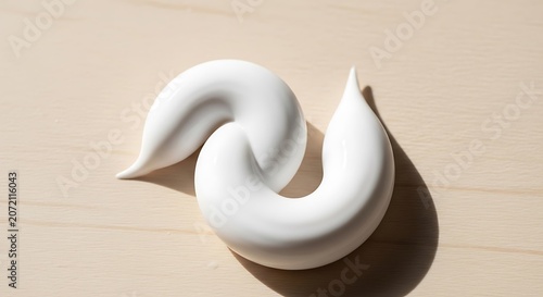 White cream cosmetic product swirl isolated.