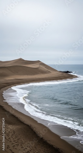 Serene ocean waves on sandy beach.