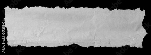 Torn paper on black
