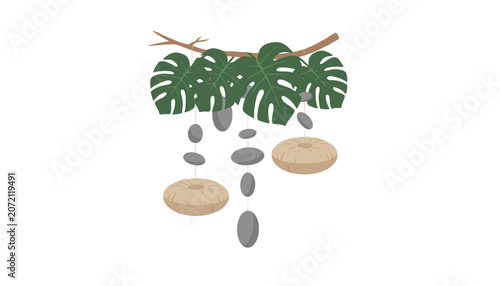 Foto Hanging mobile with green monstera leaves, grey stones, and beige meditation cushions on white background