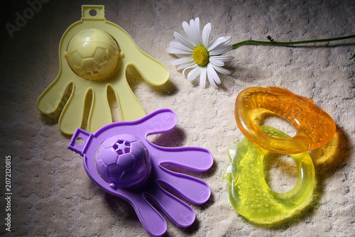 Fotografía Toys for very young children lie on a soft drapery.