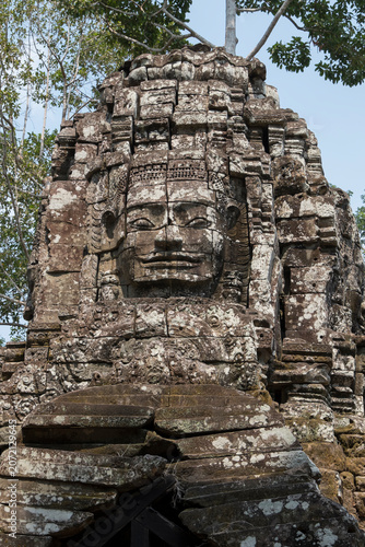 Stone heads on the gates of the Ta Som temple in Cambodia