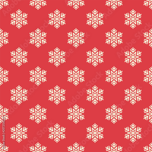 Small white snowflakes isolated on a red background. Seamless pattern. Simple flat vector graphic illustration. Texture.