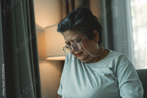 Photos Sad Elderly Asian Woman Sitting Alone with Bowed Head