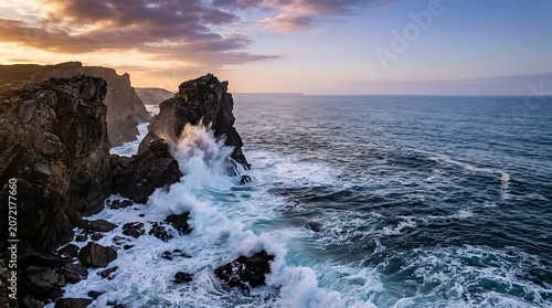 Ocean waves crashing against rugged coastal cliffs at sunset