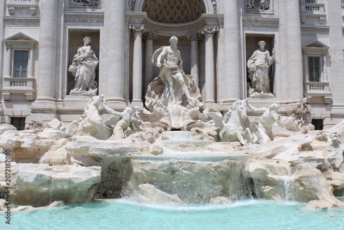 ROME, ITALY - JUNE 5, 2016: Trevi Fountain with baroque sculptures and water basin in historic Rome