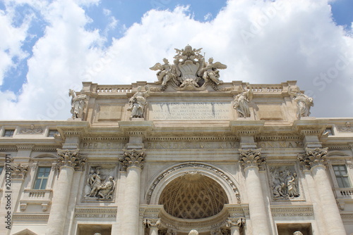 ROME, ITALY - JUNE 5, 2016: Baroque facade and marble sculptures of the Trevi Fountain