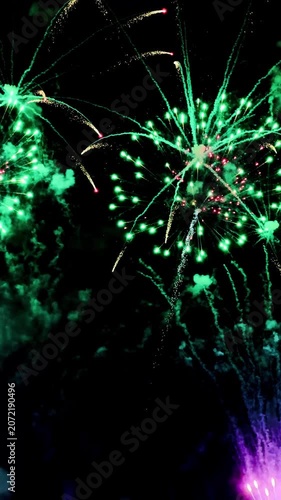  loop seamless of real fireworks background golden shining fireworks with bokeh lights in the night sky. glowing fireworks show. New year's eve fireworks celebration multiple colors 