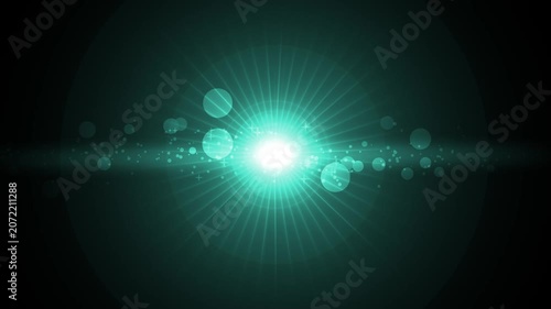 Bright lens flare centered on dark background with radial rays and bokeh light particles animation