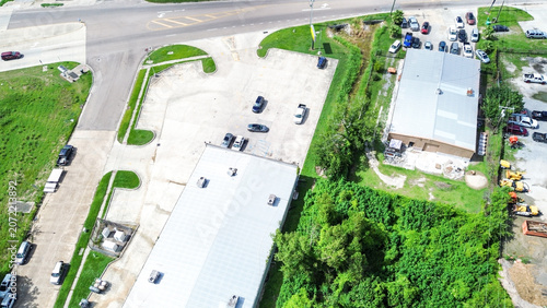 Aerial view of a commercial property with parking lots and warehouse buildings
