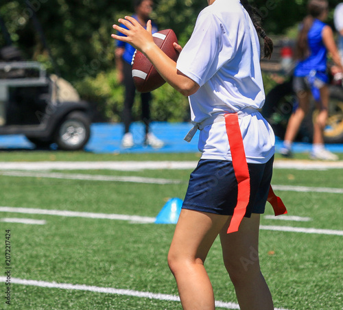 Quarterback is about to throw the football during a flag football game