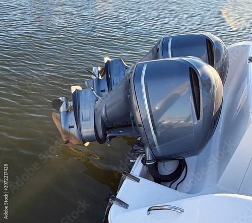 Two Large Outboard Motors on a Boat in Water