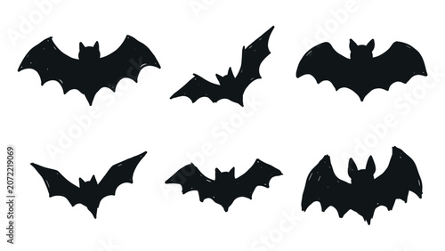 Collection of hand drawn black bat silhouettes on white background