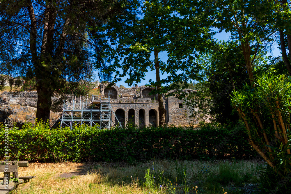 Fototapeta premium Historic archaeological ruins of the ancient roman city at the heritage site in Pompeii Italy