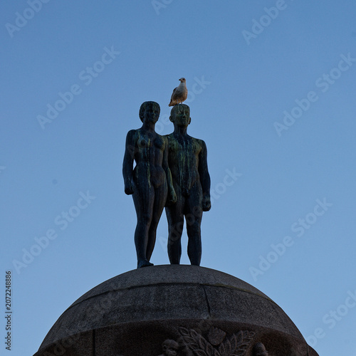 Bronze Statue of Couple Crowned by a Lone Seagull
