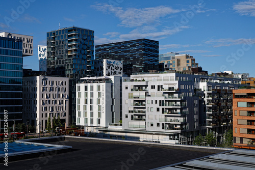 Oslo's Bjørvika Waterfront: Modern Architecture, Clarion Hotel, and Urban Development Under Blue Skies.