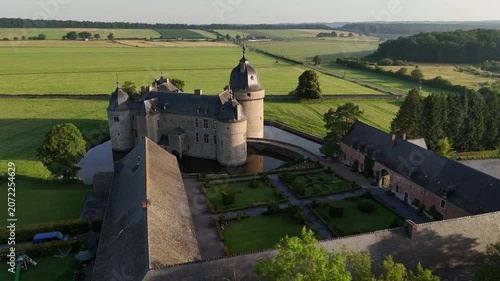 Historic castle Belgium Ardennes aerial view bathed in early morning light