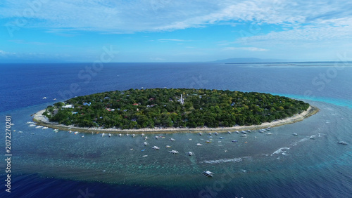 Tropical island with turquoise water and coral reef