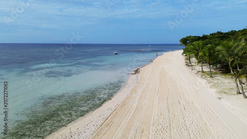 Tropical beach with white sand and palm trees