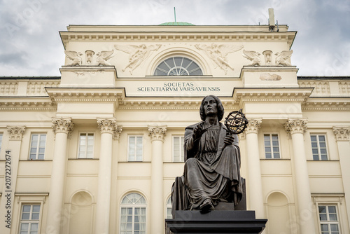 Copernicus statue in Warsaw with armillary sphere before neoclassical facade and grand columns pride