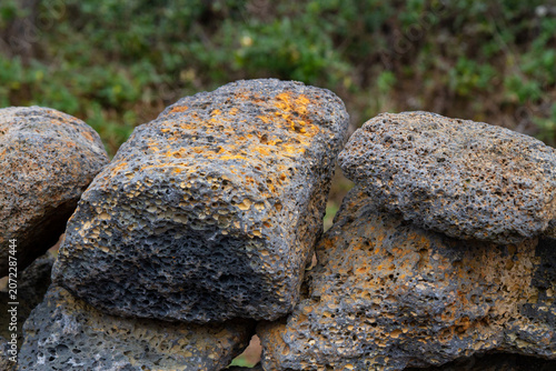 Slika na platnu Close-up of porous volcanic rocks with orange and grey textures on Jeju Island