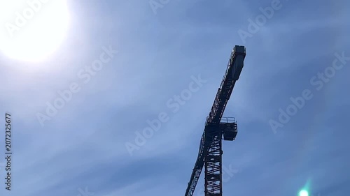 Crane in the sky video. Urban development and construction site video