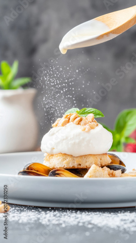 Artistic culinary presentation of grilled mussels with garlic and cream topping in a vertical stack
