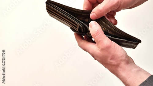 lack and shortage of money.empty wallet in the mans hands.Low salary. Lack of funds. Budget deficit and poverty concept. 4k footage