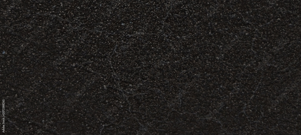 Fototapeta premium Black asphalt texture background, dark grainy road surface material, rough charcoal stone pavement for construction and architectural design