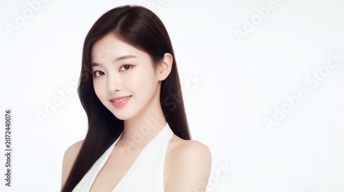 Young woman smiles with long dark hair in a studio setting during a fashion shoot or promotional event