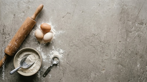 Baking ingredients on rustic kitchen surface.