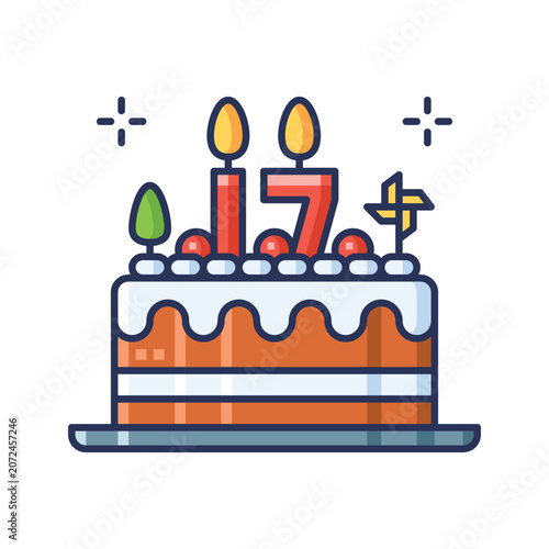 A festive birthday cake with two lit candles, colorful decorations, and a white icing layer on top, set on a plate for celebration occasions.
