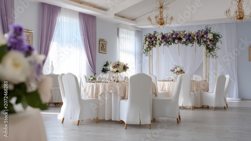 Elegant wedding reception setup with floral decorations, soft lighting, and beautiful table arrangements in a sophisticated venue