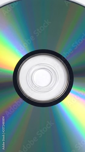 A reflective rainbow CD rests on a plain white background