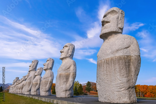 Sapporo, Japan - October 30 2025: Makomanai Takino Cemetery is a vast greenspace features a collection of 40 Moai head, a Stonehenge replica and a giant Buddha statue.