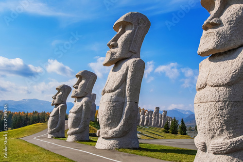 Sapporo, Japan - October 30 2025: Makomanai Takino Cemetery is a vast greenspace features a collection of 40 Moai head, a Stonehenge replica and a giant Buddha statue.