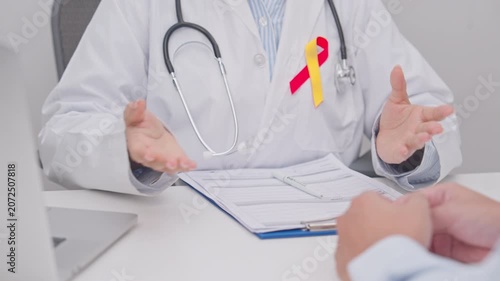 World hepatitis day awareness month, 28 July. Doctor and patient having medical consultation for Red and Yellow ribbon for Liver cancer, Jaundice, Cirrhosis, Failure, Enlarged, Hepatic Encephalopathy