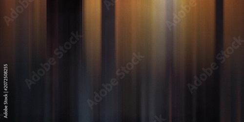 Dark moody background with golden vertical light shafts creating elegant ethereal atmosphere with subtle soft textured gradient.