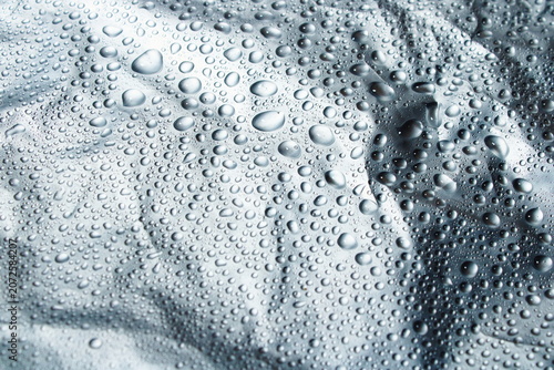 Water Drops On Silver Metallic Foil Texture Background With Abstract Patterns
