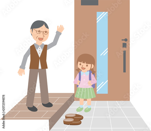 玄関で登校する女の子を見送る祖父・ランドセル・朝の見送り
