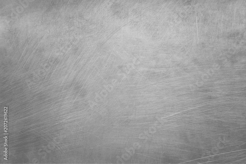 Photos Scratched metallic silver background with a textured surface