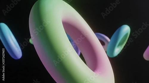 Abstract 3D Rendered Torus Shapes Floating in Dark Space.